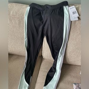 Marika leggings Size 10/12 Black with mint green and gray stripe down each side